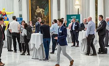 Delegates networking at World BI event